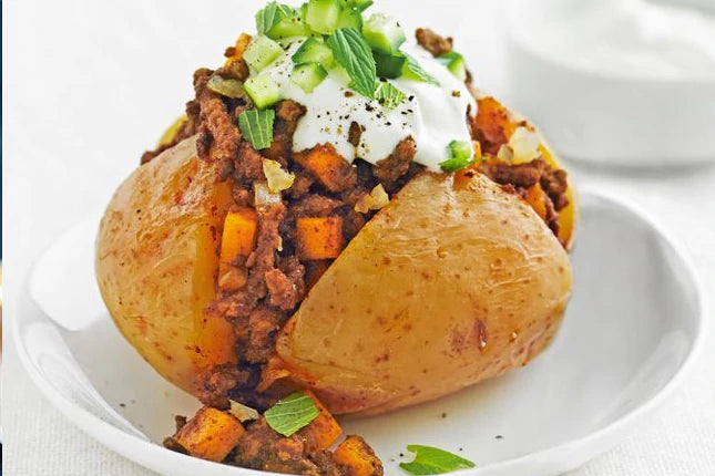 Baked potatoes with kidney beans, almonds & sauerkraut