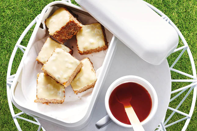 Ginger and sesame bars with passionfruit tahini drizzle