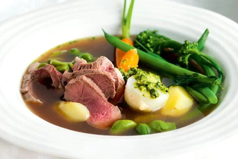 Poached lamb with spring vegetables